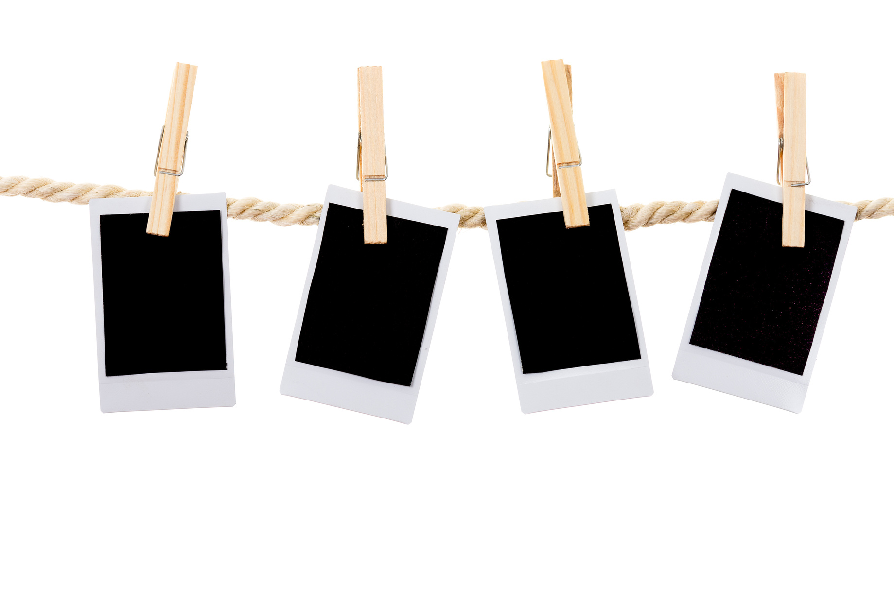 instant photographs hanging on a rope clothesline